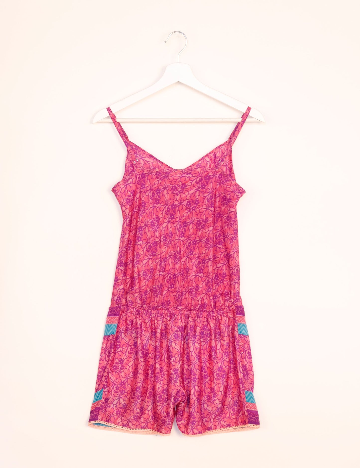 Vibrant playsuit with lace accents, crafted from upcycled saris. Embrace ethical fashion with this unique piece designed for conscious consumers.