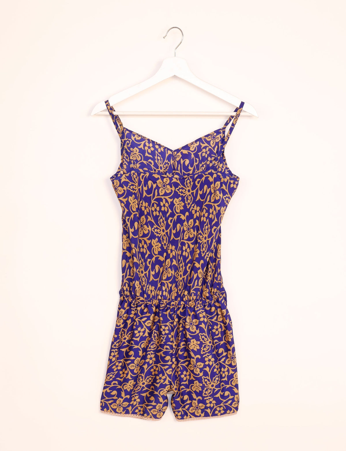 Vibrant playsuit with lace accents, crafted from upcycled saris. Embrace ethical fashion with this unique piece designed for conscious consumers.