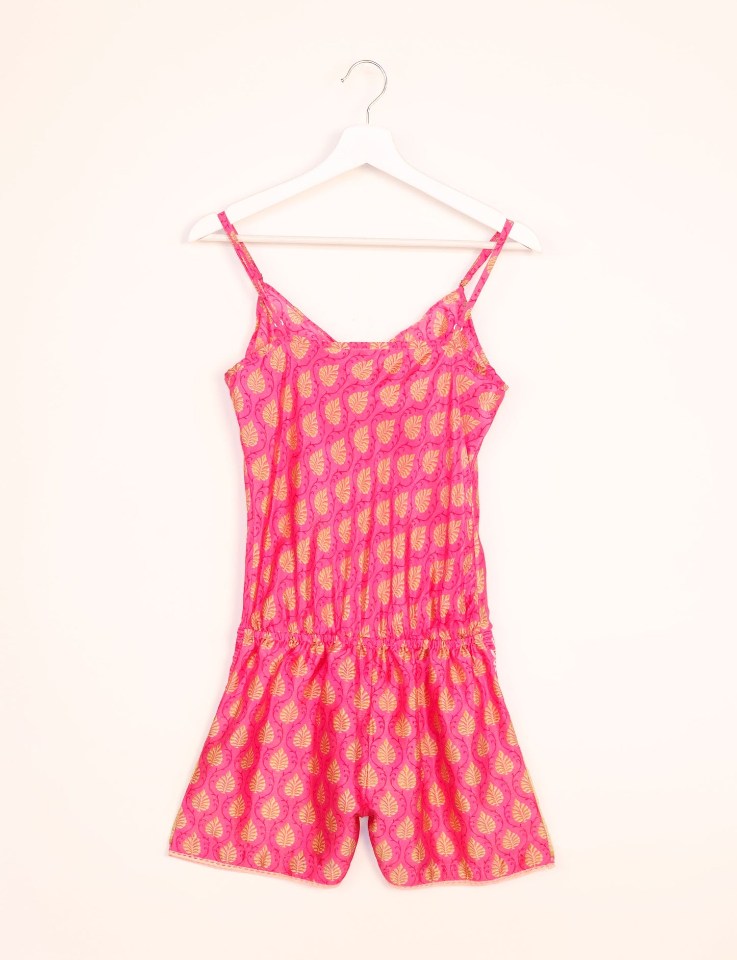 Vibrant playsuit with lace accents, crafted from upcycled saris. Embrace ethical fashion with this unique piece designed for conscious consumers.