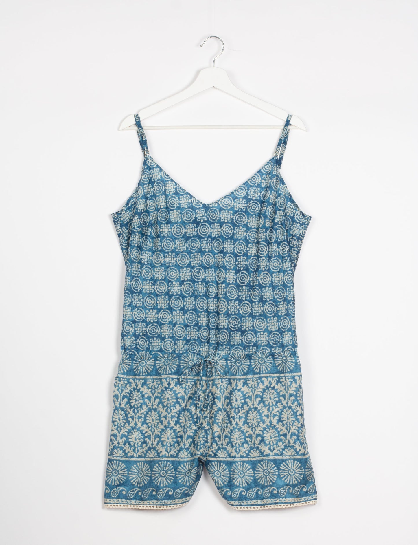 Vibrant playsuit with lace accents, crafted from upcycled saris. Embrace ethical fashion with this unique piece designed for conscious consumers.