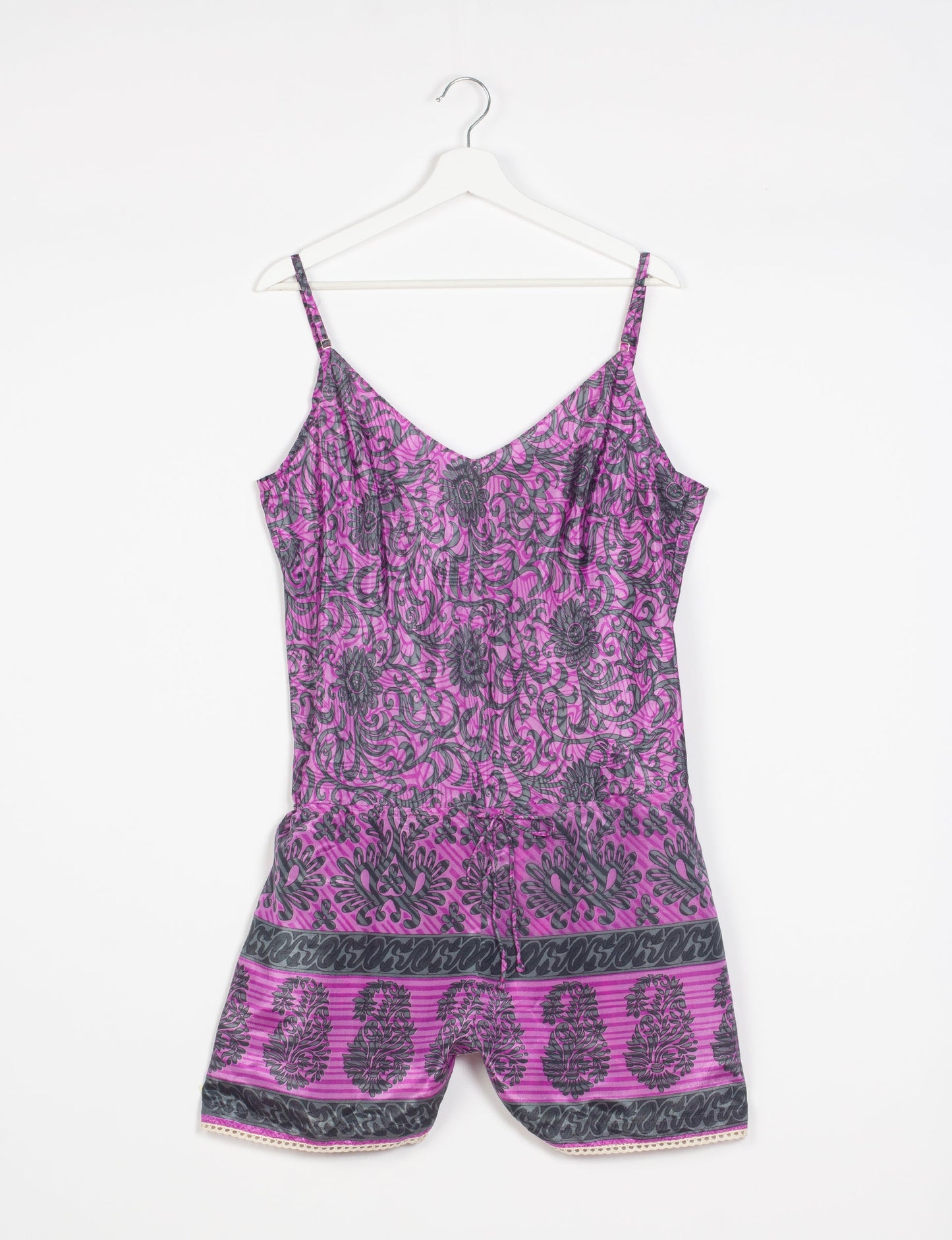 Vibrant playsuit with lace accents, crafted from upcycled saris. Embrace ethical fashion with this unique piece designed for conscious consumers.