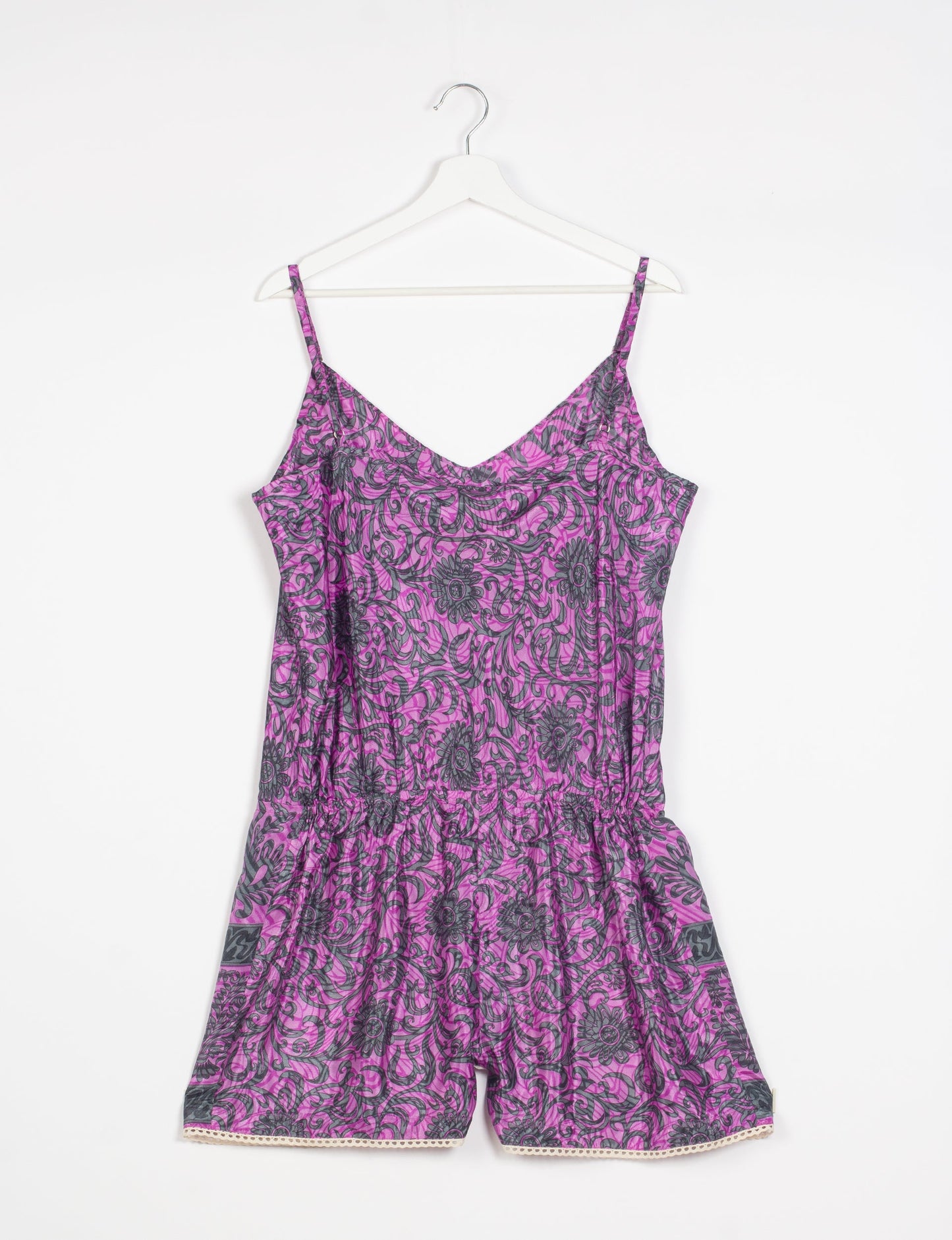 Vibrant playsuit with lace accents, crafted from upcycled saris. Embrace ethical fashion with this unique piece designed for conscious consumers.