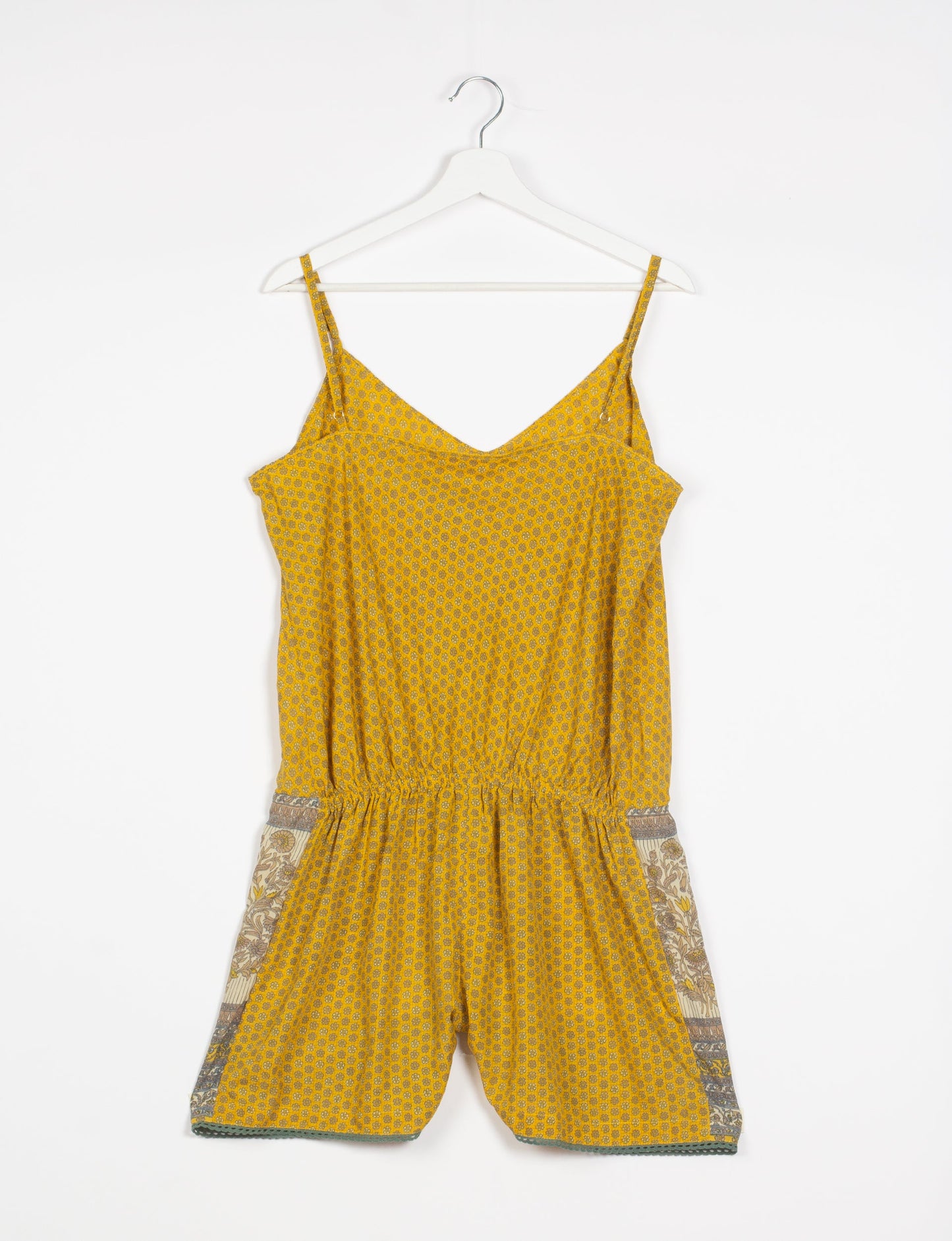 Vibrant playsuit with lace accents, crafted from upcycled saris. Embrace ethical fashion with this unique piece designed for conscious consumers.