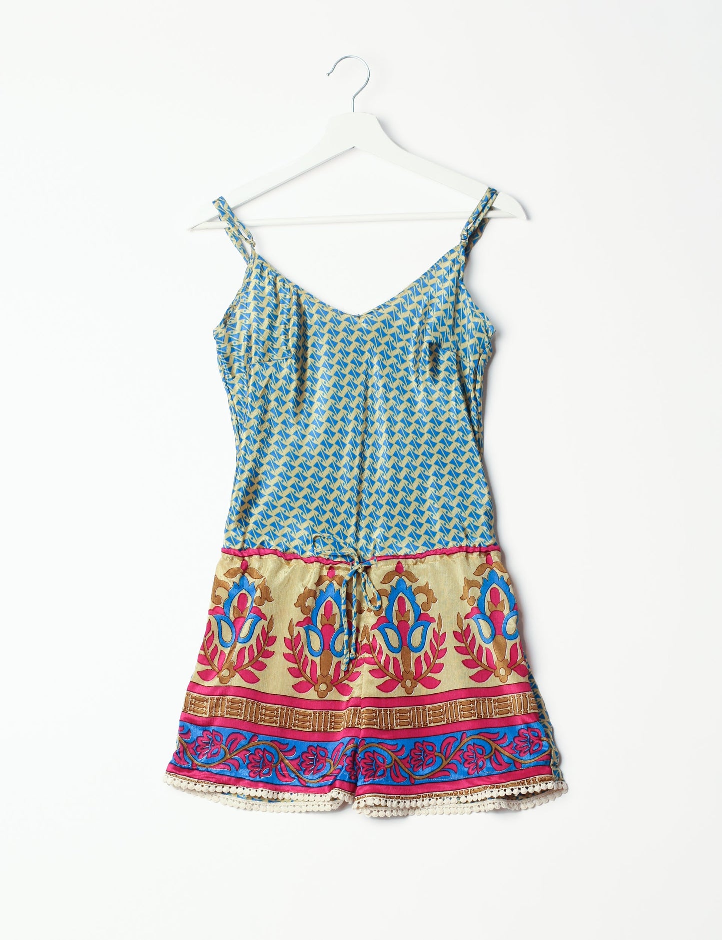 Vibrant playsuit with lace accents, crafted from upcycled saris. Embrace ethical fashion with this unique piece designed for conscious consumers.