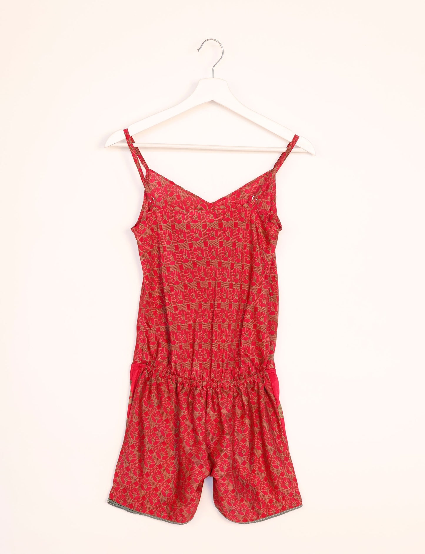 Vibrant playsuit with lace accents, crafted from upcycled saris. Embrace ethical fashion with this unique piece designed for conscious consumers.