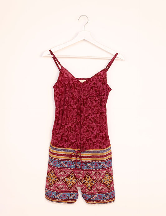 Vibrant playsuit with lace accents, crafted from upcycled saris. Embrace ethical fashion with this unique piece designed for conscious consumers.