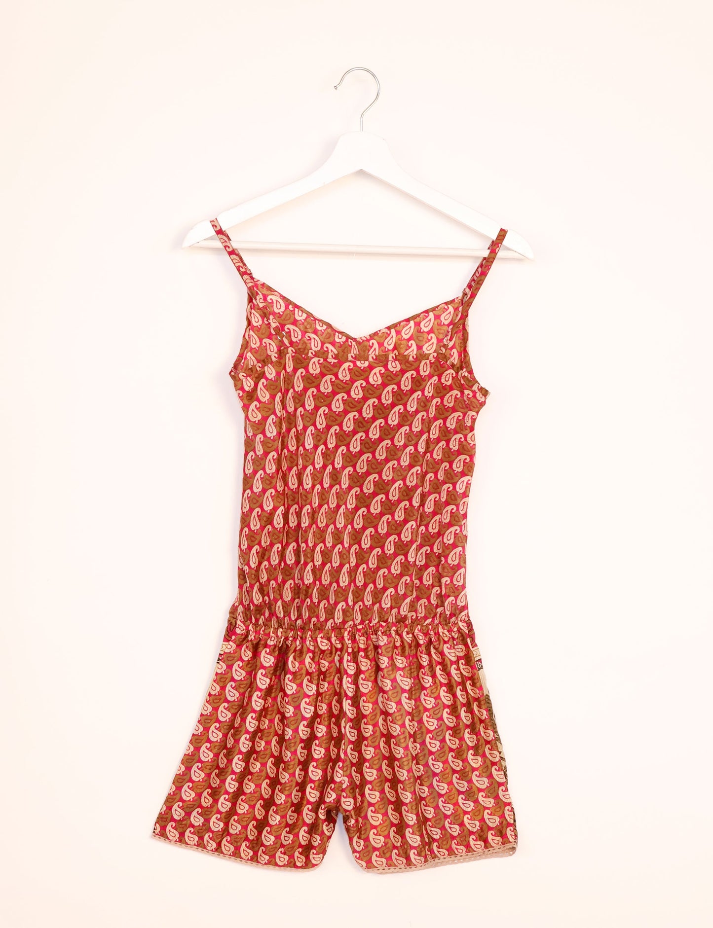 Vibrant playsuit with lace accents, crafted from upcycled saris. Embrace ethical fashion with this unique piece designed for conscious consumers.