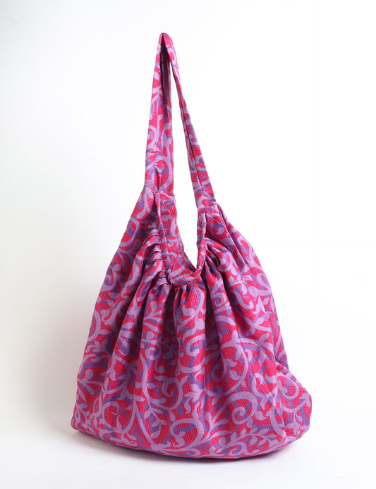 A stylish HOBO BAG made from recycled materials, perfect for eco-conscious fashionistas.