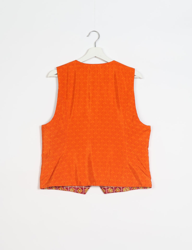 Orange waistcoat with subtle leaf pattern, sleeveless, shown from back on white hanger against white background