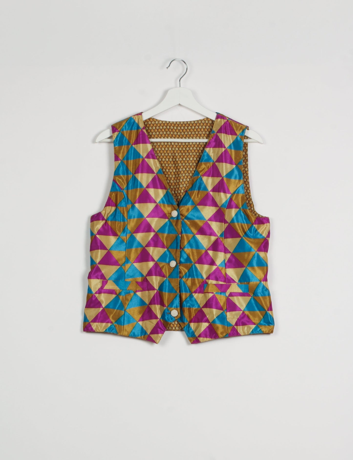 Day Waistcoat made from repurposed saris with macramé-covered buttons, showcasing eco clothing and recycled sari fashion for an eco-friendly, upcycled women's garment.