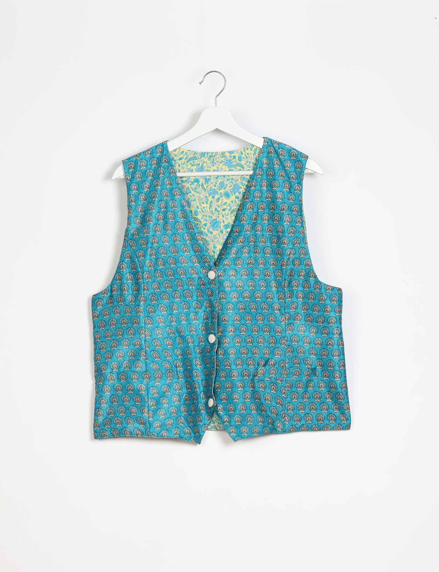 Day Waistcoat made from repurposed saris with macramé-covered buttons, showcasing eco clothing and recycled sari fashion for an eco-friendly, upcycled women's garment.