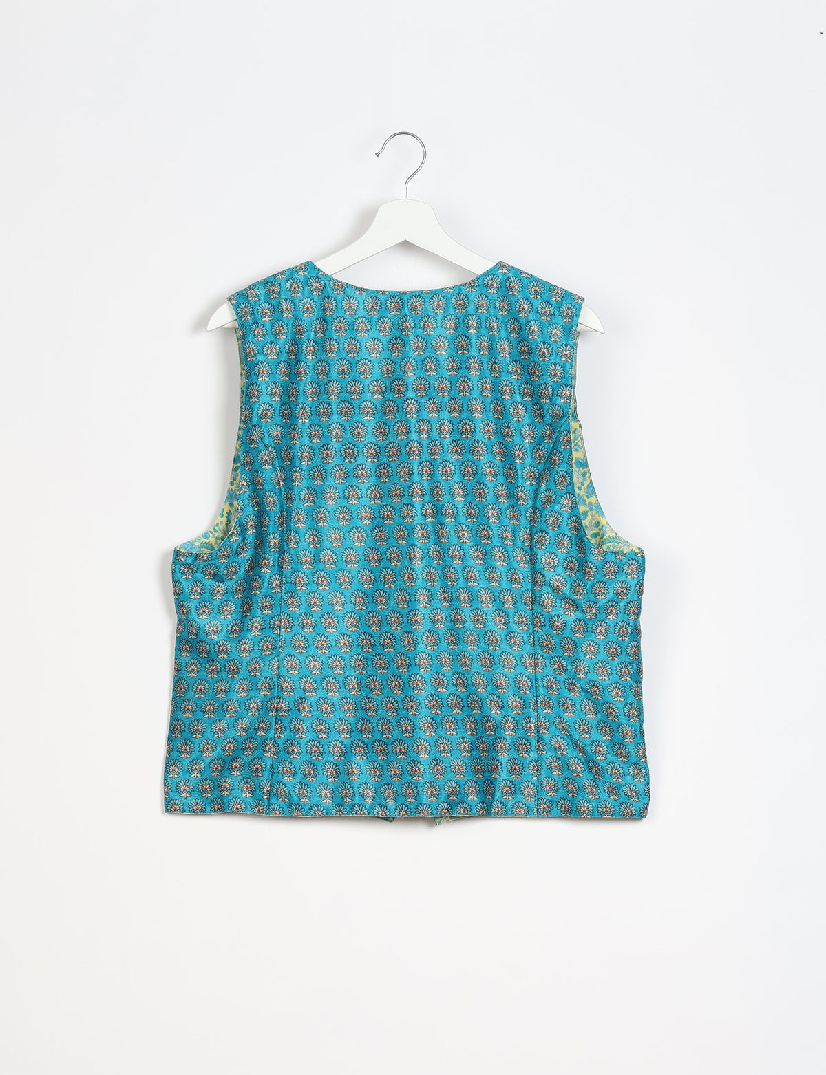 Blue sleeveless waistcoat with small floral micro design pattern, shown from back on white hanger against white background
