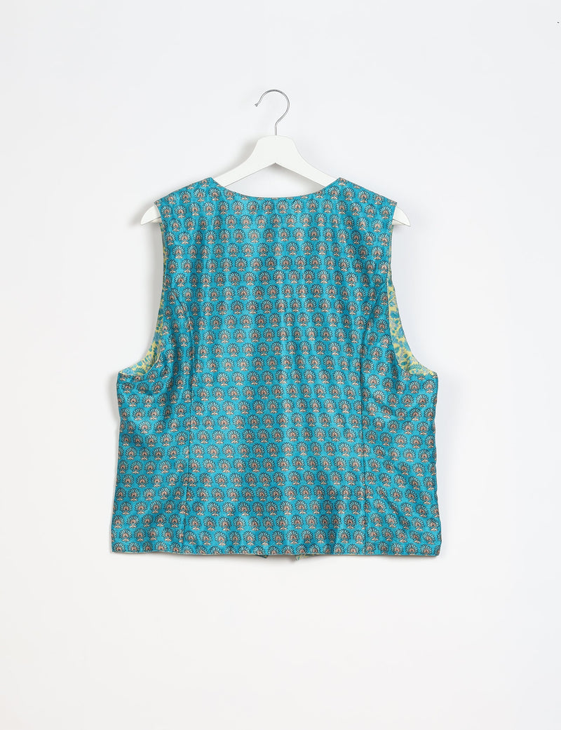 Blue sleeveless waistcoat with small floral micro design pattern, shown from back on white hanger against white background