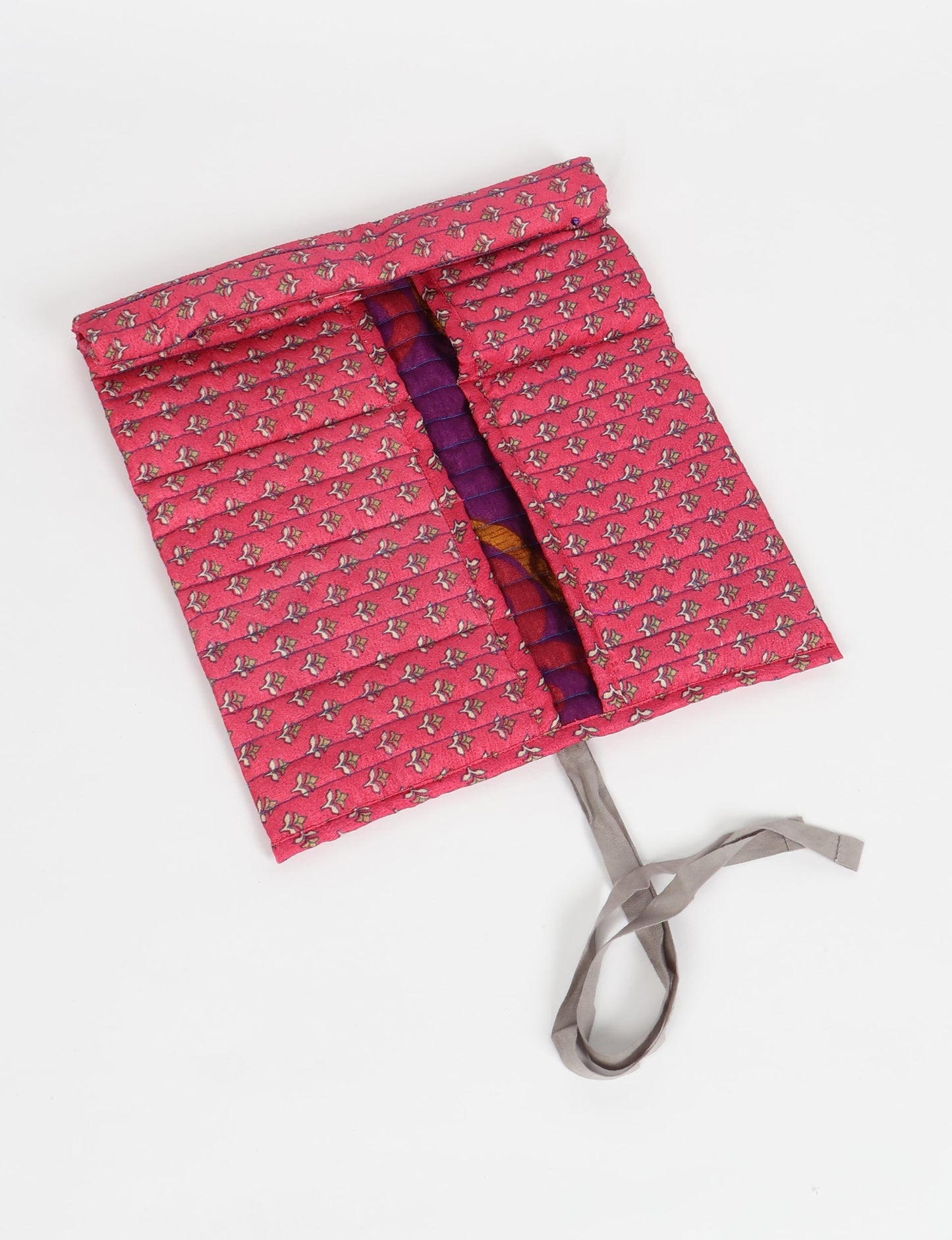Roll-Up Organizer made from repurposed sari fabric, showcasing compact design and sustainable fashion innovation.