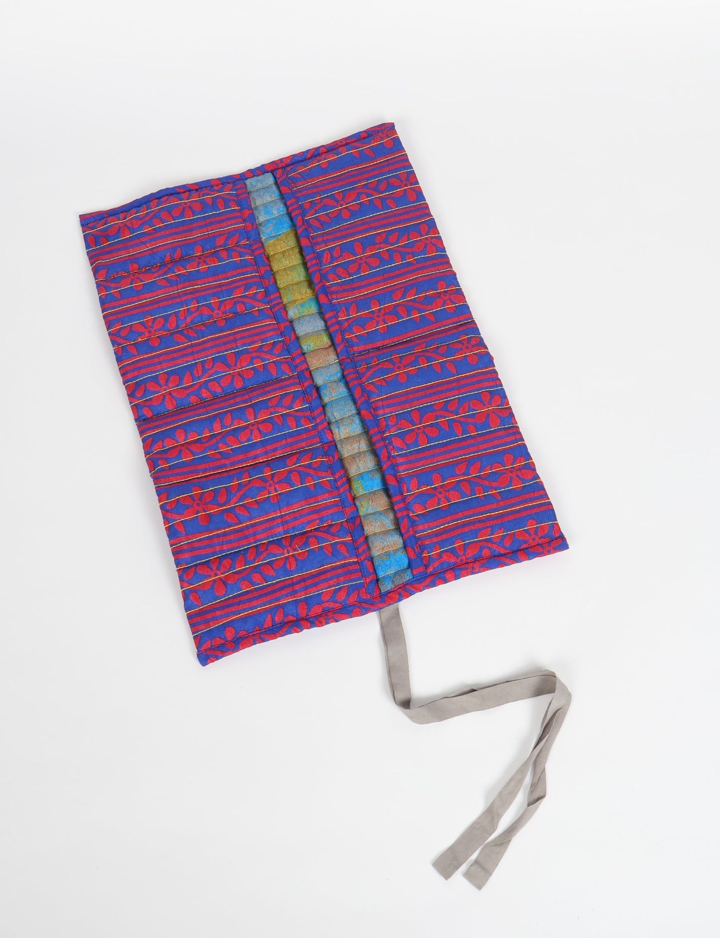 Roll-Up Organizer made from repurposed sari fabric, showcasing compact design and sustainable fashion innovation.