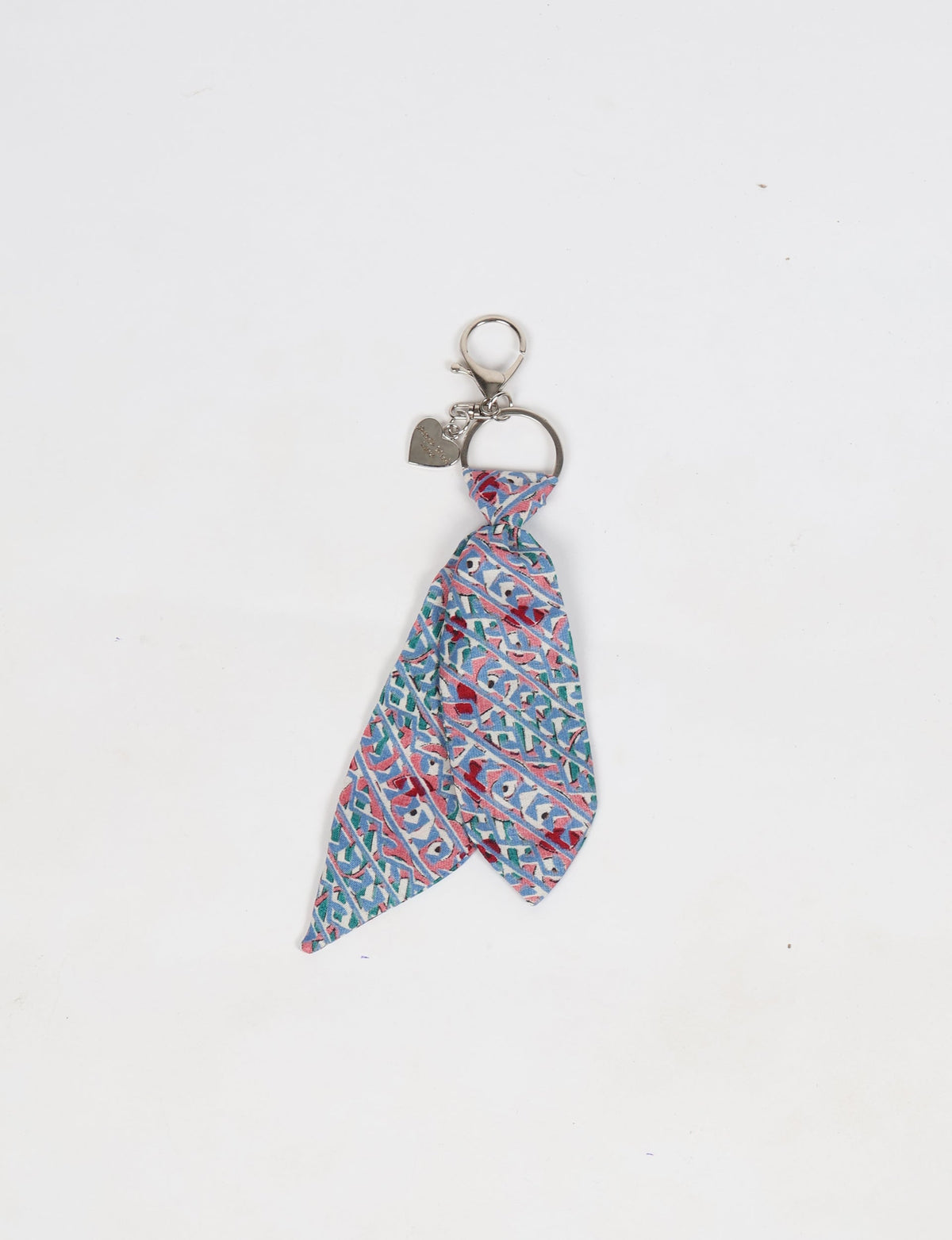 Grey tie keychain with micro geometric pattern and silver heart charm, shown flat on white background