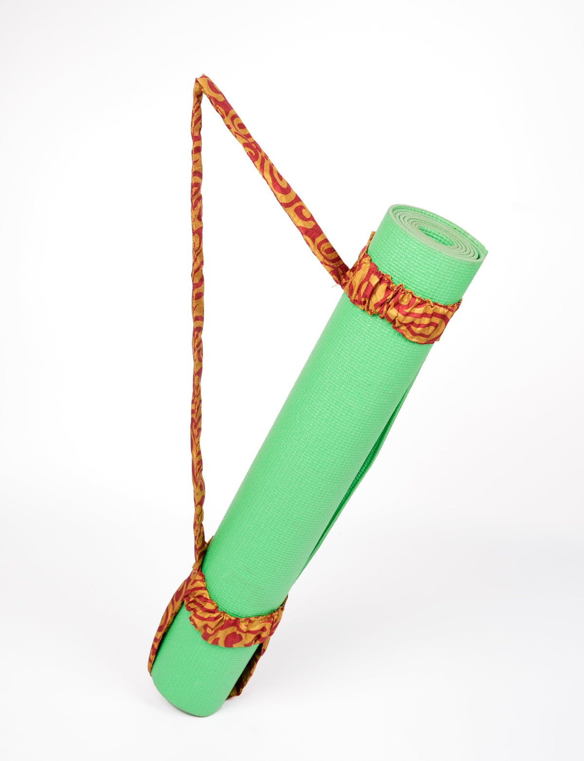 A green yoga mat holder made from upcycled materials, embodying ethical and sustainable fashion ideals.