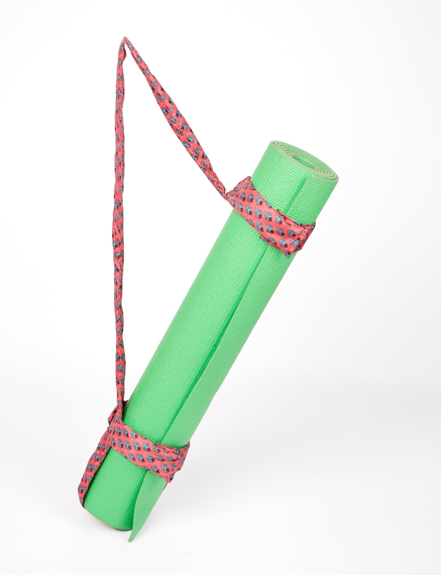 A green yoga mat holder made from upcycled materials, embodying ethical and sustainable fashion ideals.