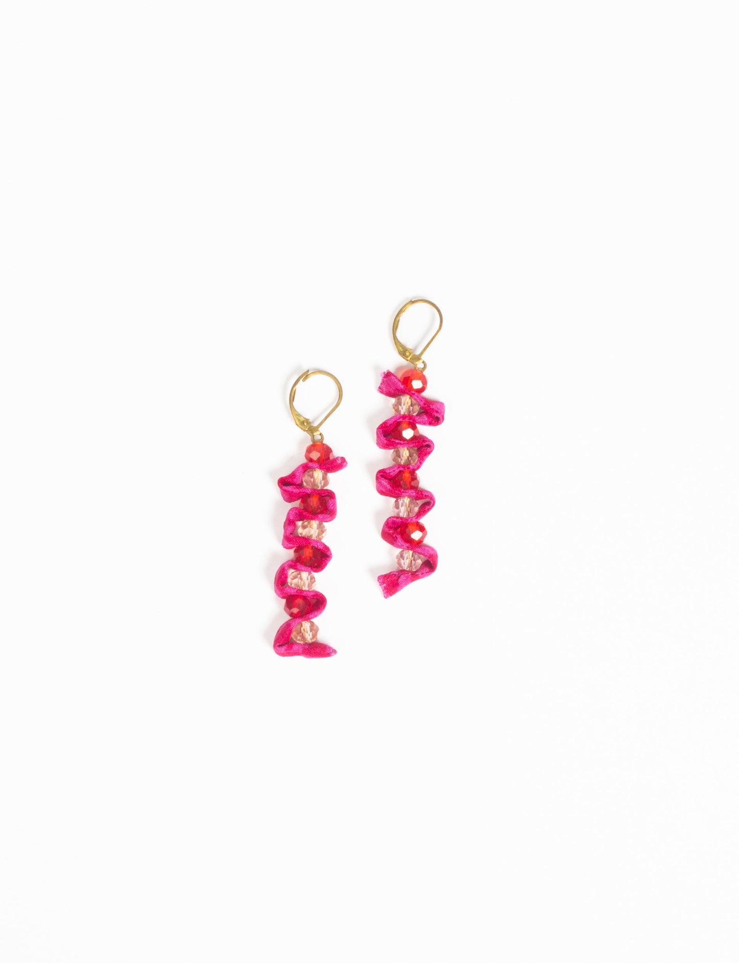 Wavy Dangler Earrings made from upcycled materials, showcasing eco-friendly fashion and sustainable women's clothing. A delicate blend of style and environmentally friendly design, perfect for those who value conscious clothing and circular fashion.