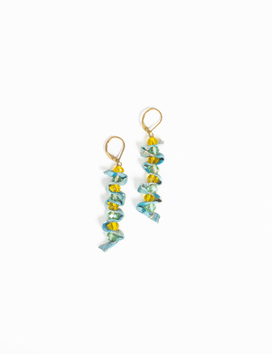 Wavy Dangler Earrings made from upcycled materials, showcasing eco-friendly fashion and sustainable women's clothing. A delicate blend of style and environmentally friendly design, perfect for those who value conscious clothing and circular fashion.