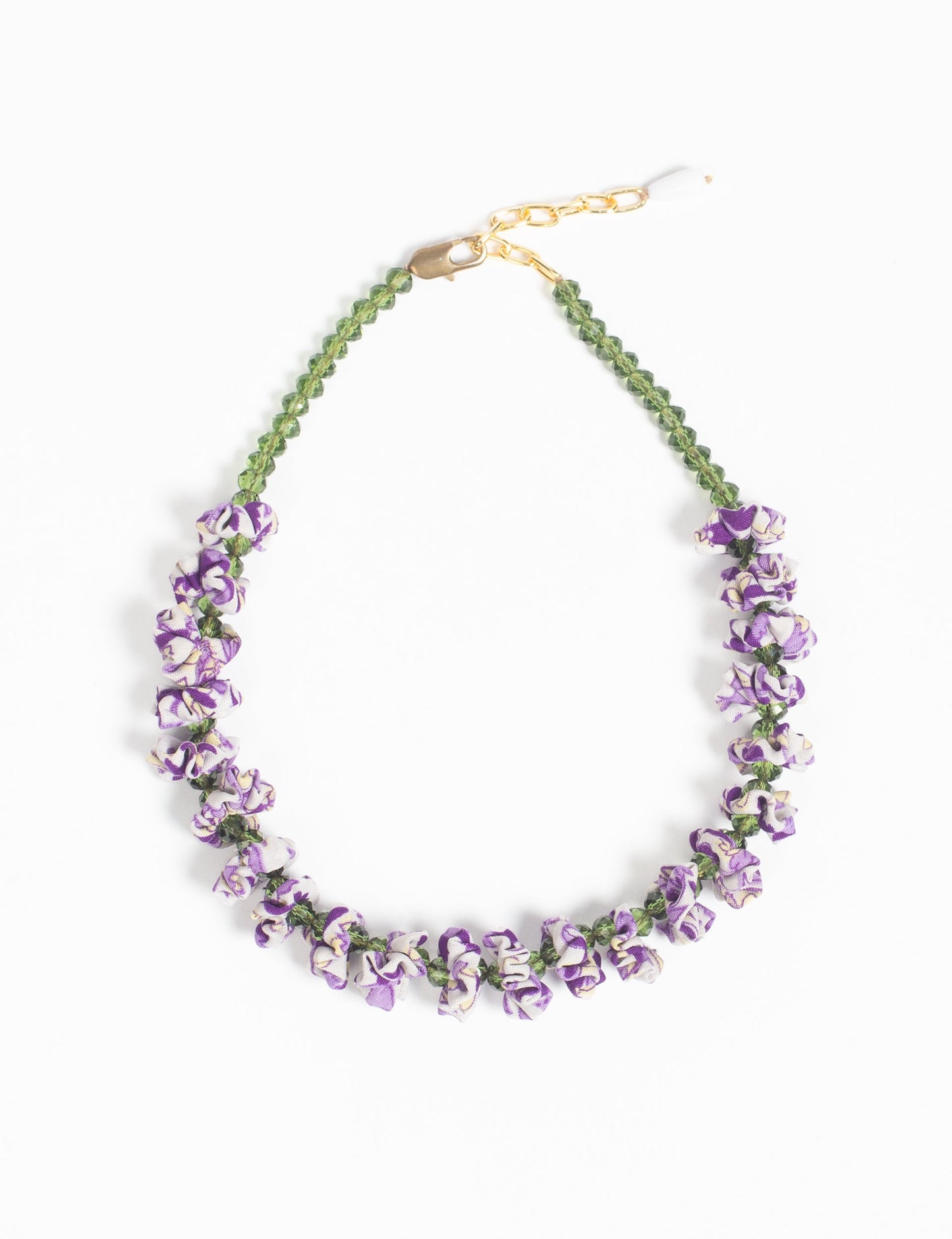 Floret Necklace with vibrant beaded accents, designed from recycled materials, embodying upcycled women’s clothing and green fashion ideals. Perfect eco-friendly fashion accessory for sustainable apparel enthusiasts.