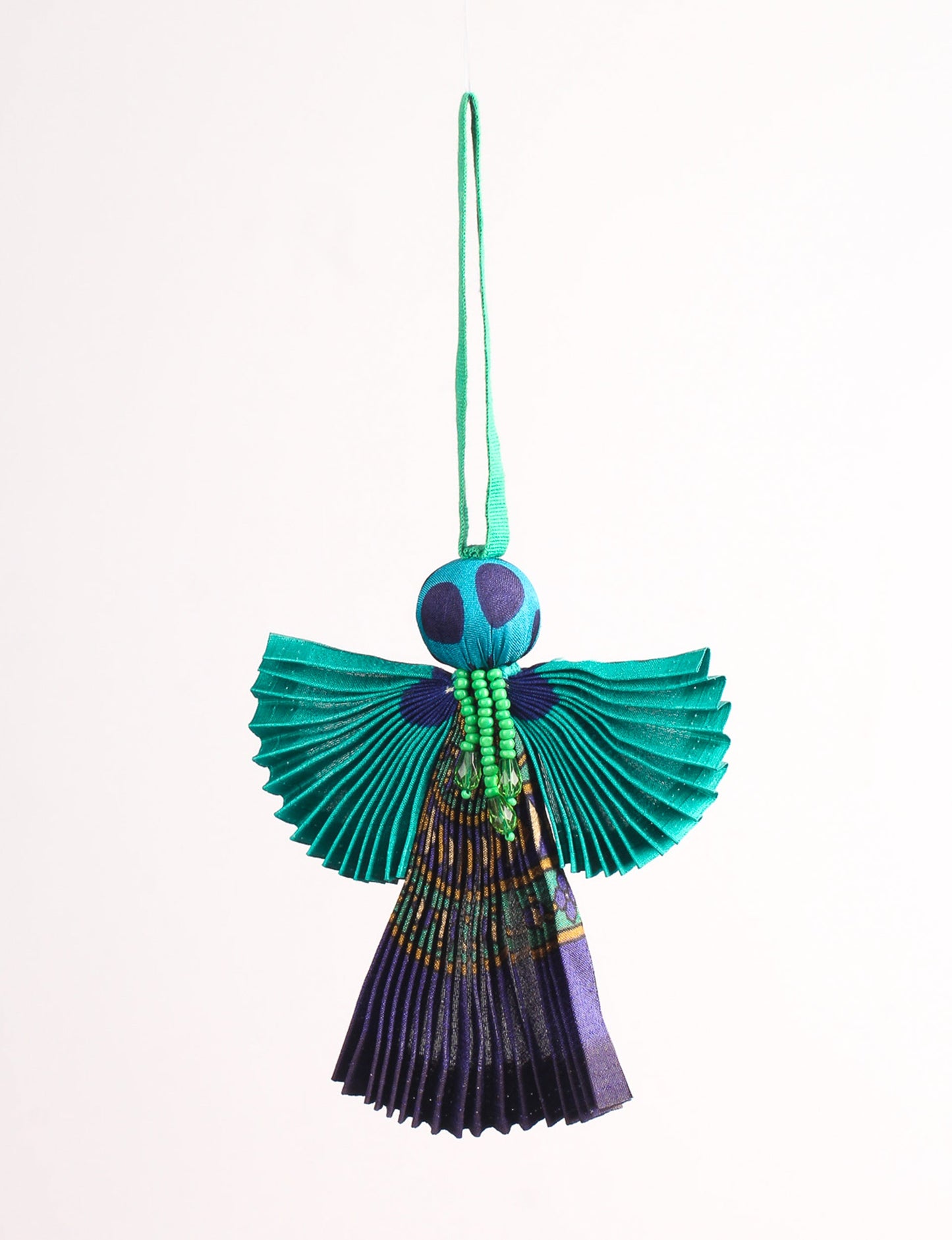 Angel Christmas Ornament made from upcycled saris, featuring pleated arms and body. A sustainable, eco-friendly holiday decoration, embodying recycled fashion and upcycling in festive style.





