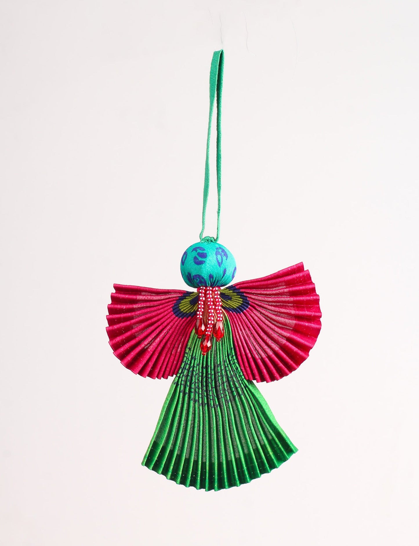 Angel Christmas Ornament made from upcycled saris, featuring pleated arms and body. A sustainable, eco-friendly holiday decoration, embodying recycled fashion and upcycling in festive style.





