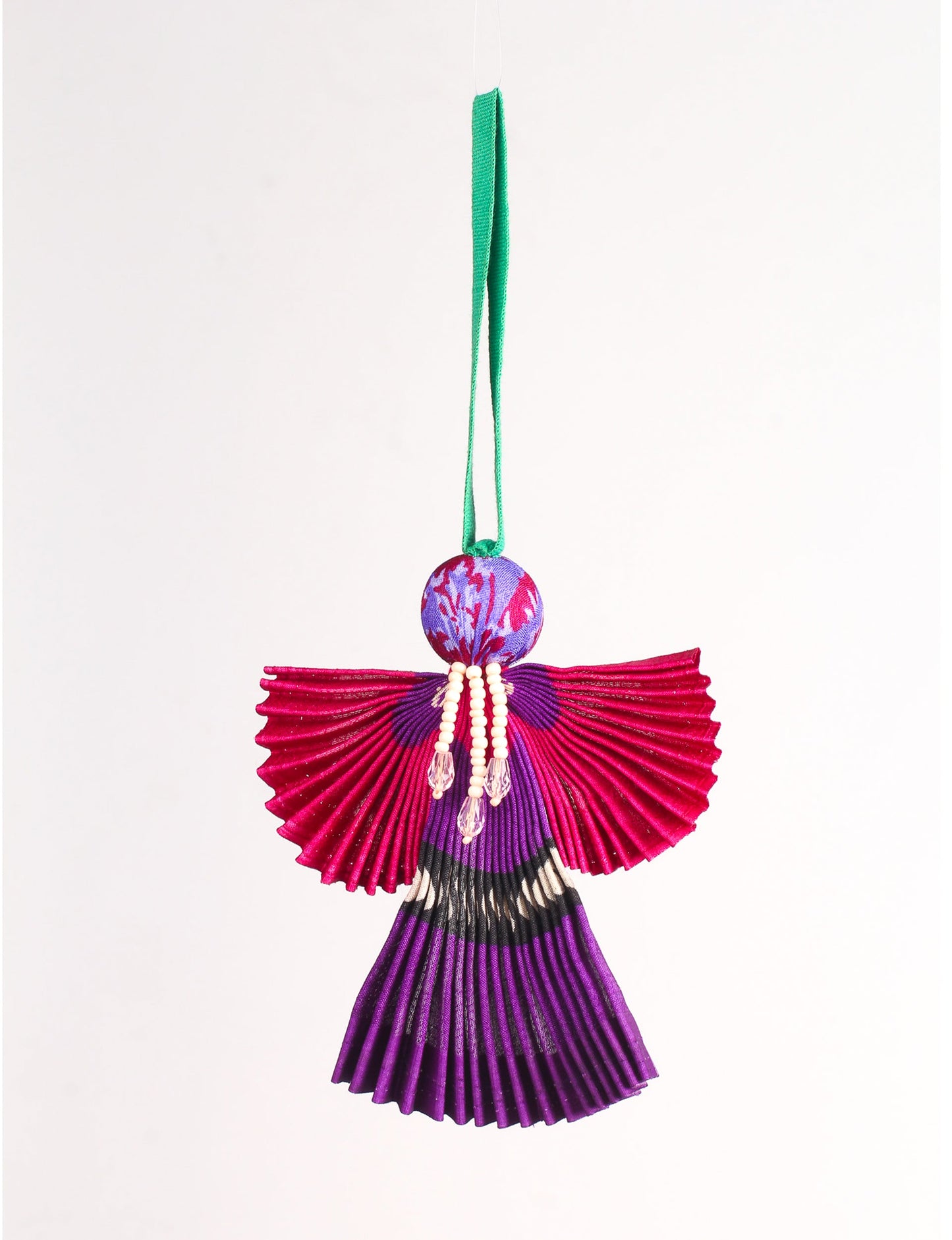 Angel Christmas Ornament made from upcycled saris, featuring pleated arms and body. A sustainable, eco-friendly holiday decoration, embodying recycled fashion and upcycling in festive style.





