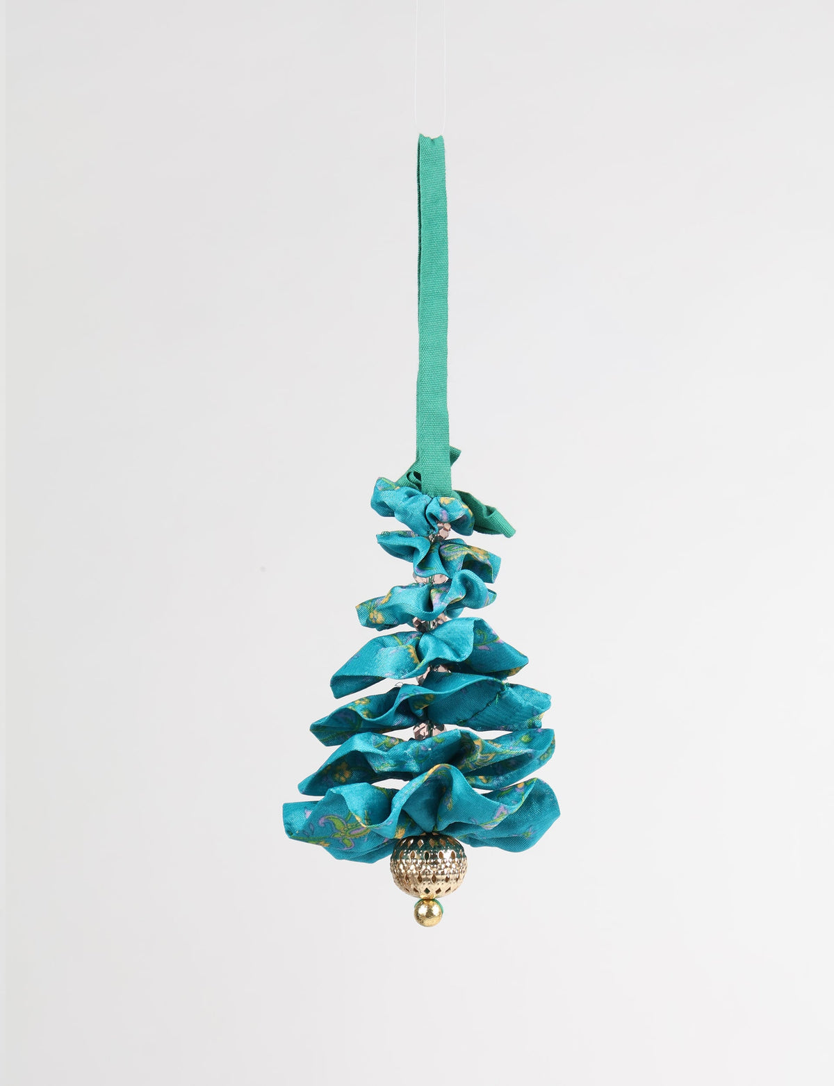 Blue fabric Christmas tree ornament with ruffled layers, gold bead at base, and green hanging loop, front view on white background