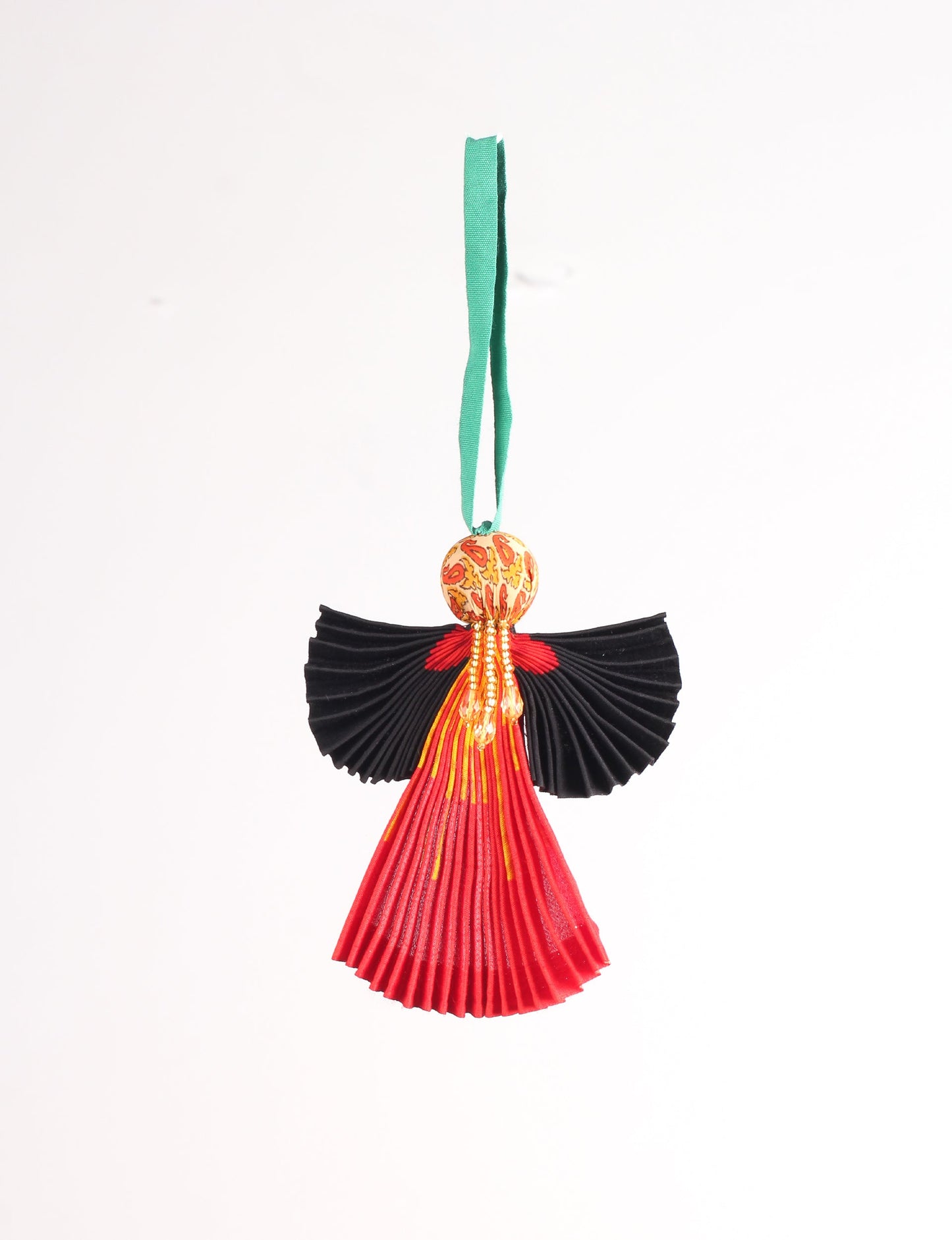 Angel Christmas Ornament made from upcycled saris, featuring pleated arms and body. A sustainable, eco-friendly holiday decoration, embodying recycled fashion and upcycling in festive style.





