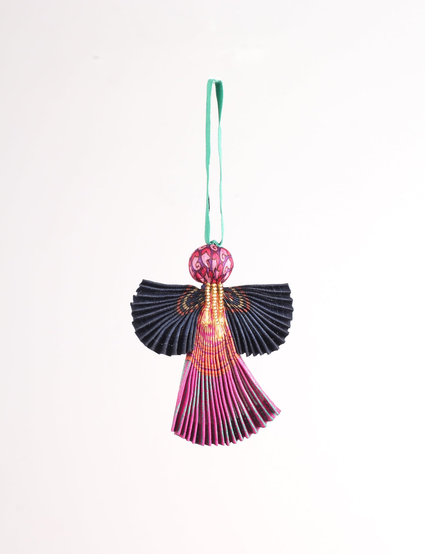 Angel Christmas Ornament made from upcycled saris, featuring pleated arms and body. A sustainable, eco-friendly holiday decoration, embodying recycled fashion and upcycling in festive style.





