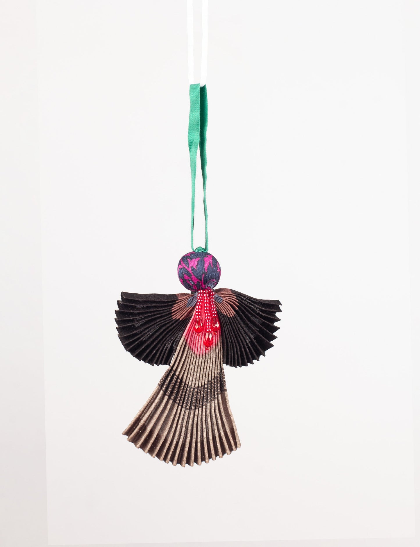 Angel Christmas Ornament made from upcycled saris, featuring pleated arms and body. A sustainable, eco-friendly holiday decoration, embodying recycled fashion and upcycling in festive style.





