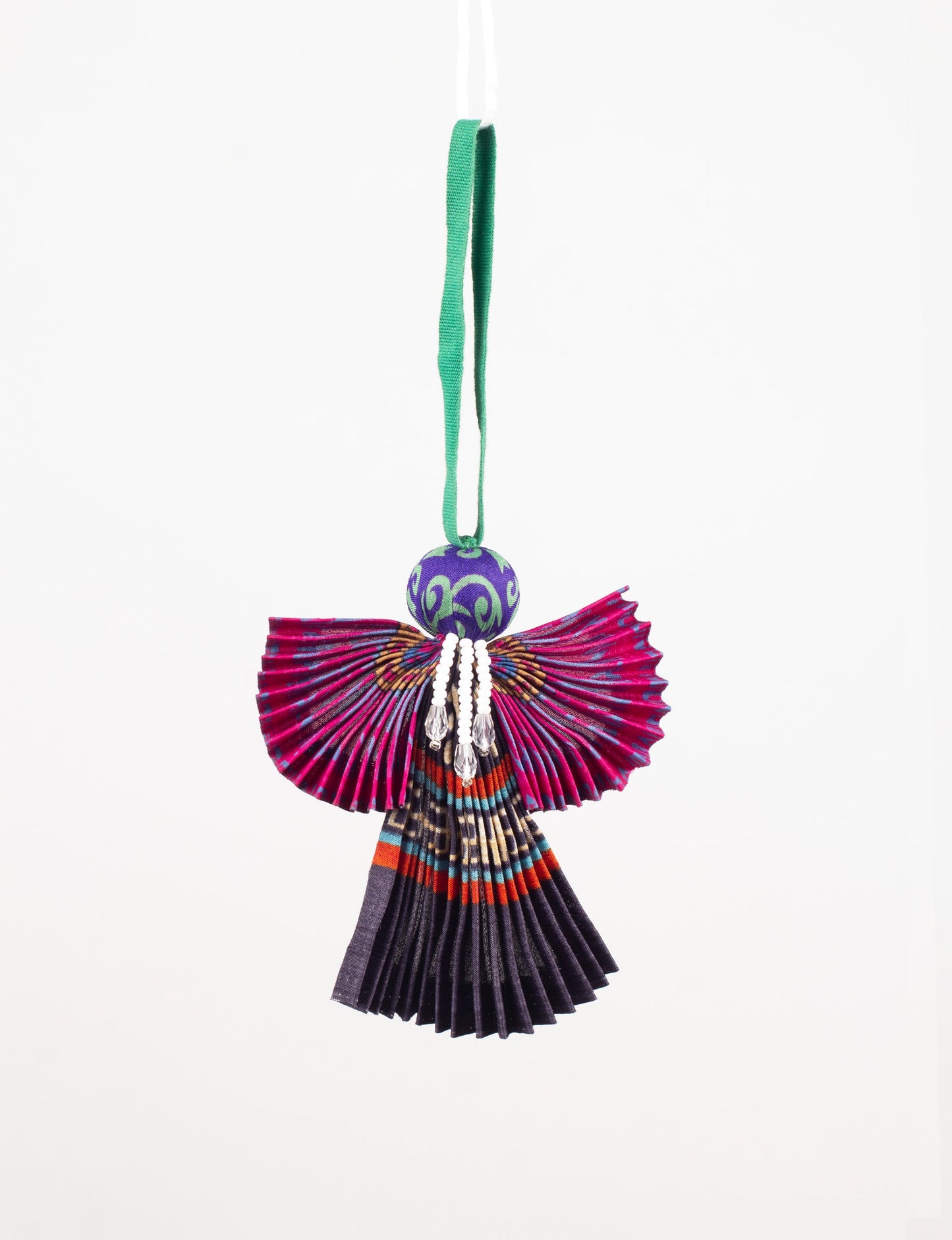 Angel Christmas Ornament made from upcycled saris, featuring pleated arms and body. A sustainable, eco-friendly holiday decoration, embodying recycled fashion and upcycling in festive style.





