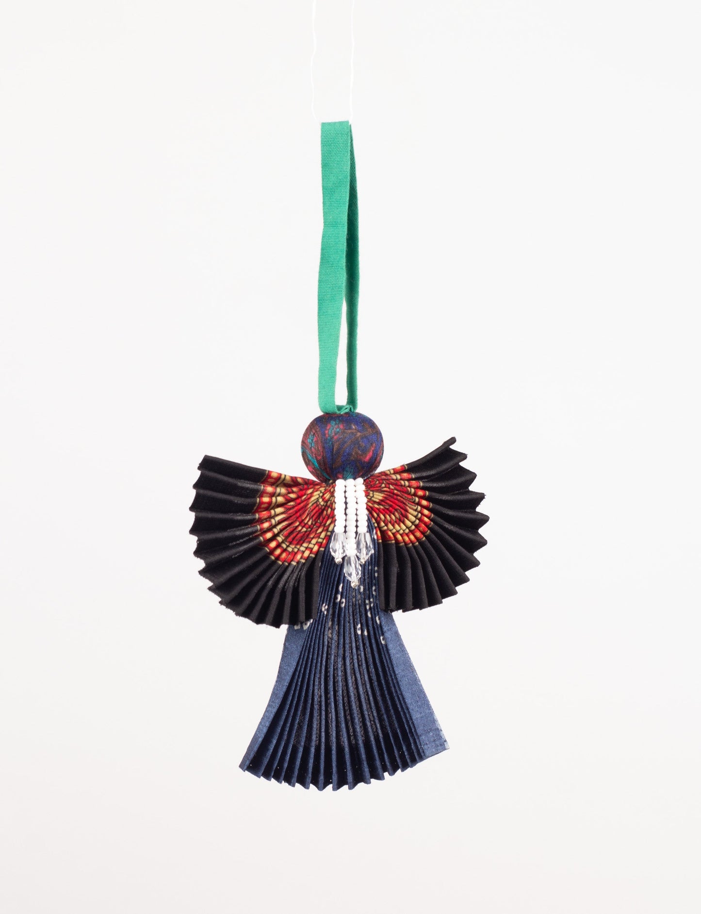 Angel Christmas Ornament made from upcycled saris, featuring pleated arms and body. A sustainable, eco-friendly holiday decoration, embodying recycled fashion and upcycling in festive style.





