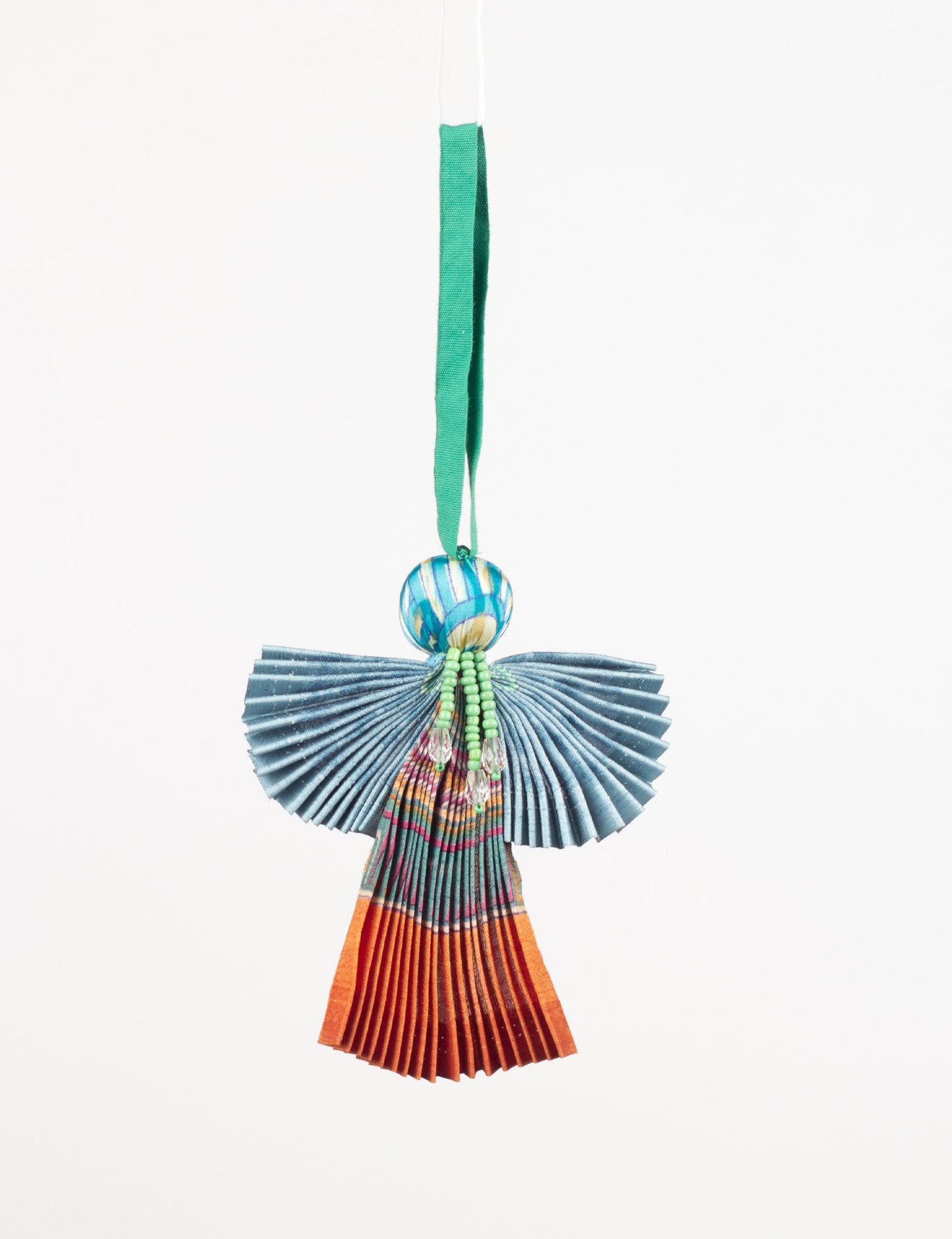 Angel Christmas Ornament made from upcycled saris, featuring pleated arms and body. A sustainable, eco-friendly holiday decoration, embodying recycled fashion and upcycling in festive style.





