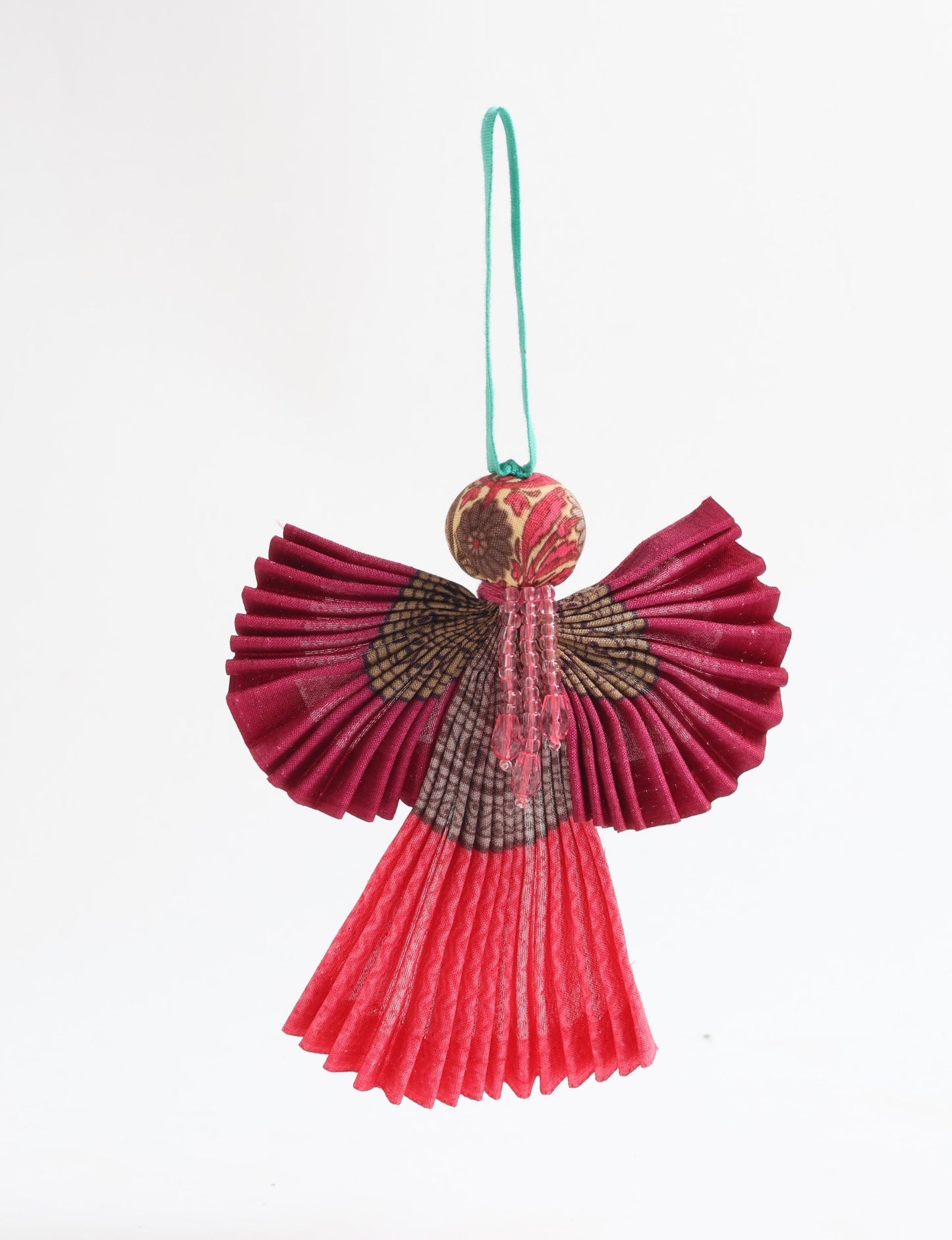 Angel Christmas Ornament made from upcycled saris, featuring pleated arms and body. A sustainable, eco-friendly holiday decoration, embodying recycled fashion and upcycling in festive style.





