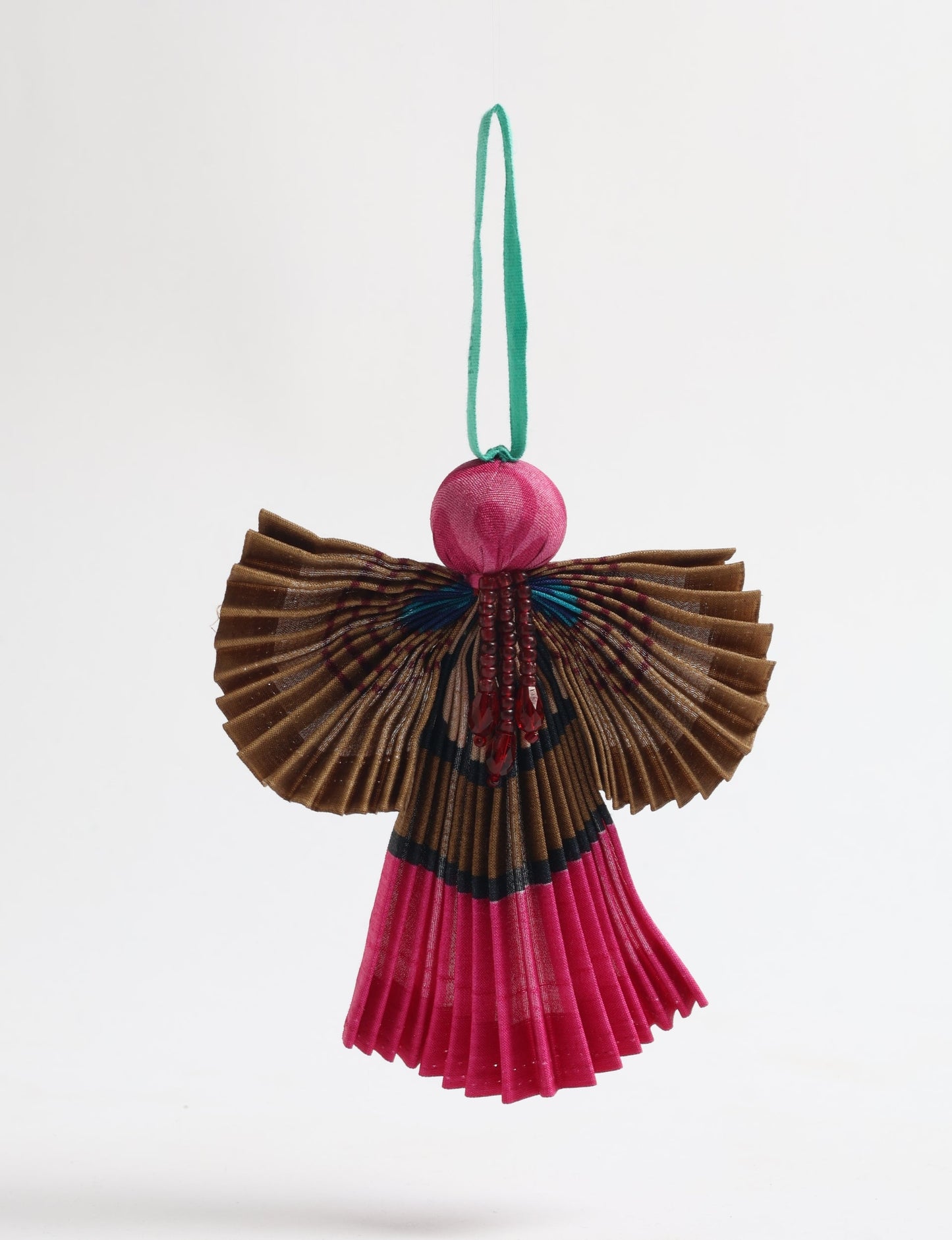 Angel Christmas Ornament made from upcycled saris, featuring pleated arms and body. A sustainable, eco-friendly holiday decoration, embodying recycled fashion and upcycling in festive style.





