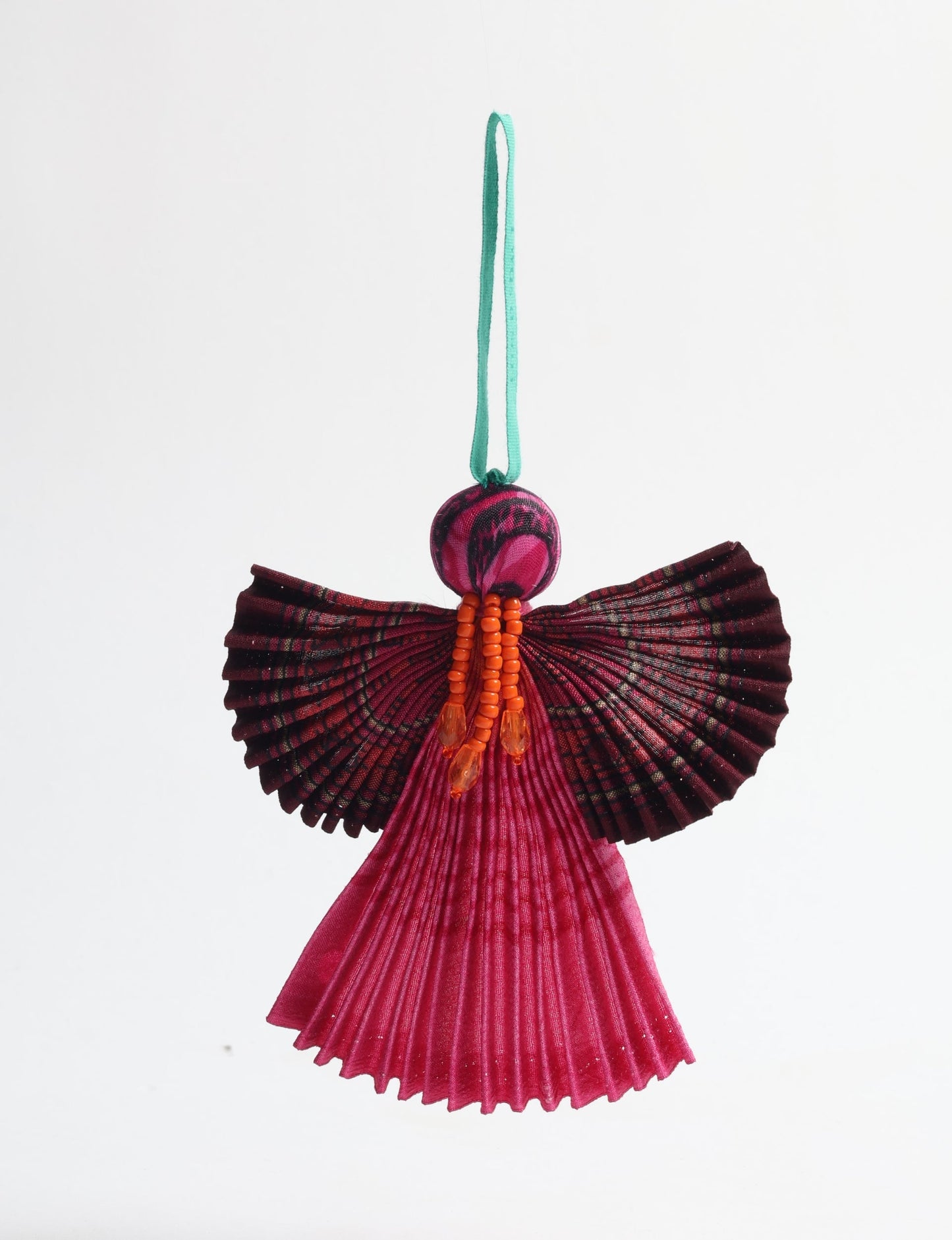 Angel Christmas Ornament made from upcycled saris, featuring pleated arms and body. A sustainable, eco-friendly holiday decoration, embodying recycled fashion and upcycling in festive style.





