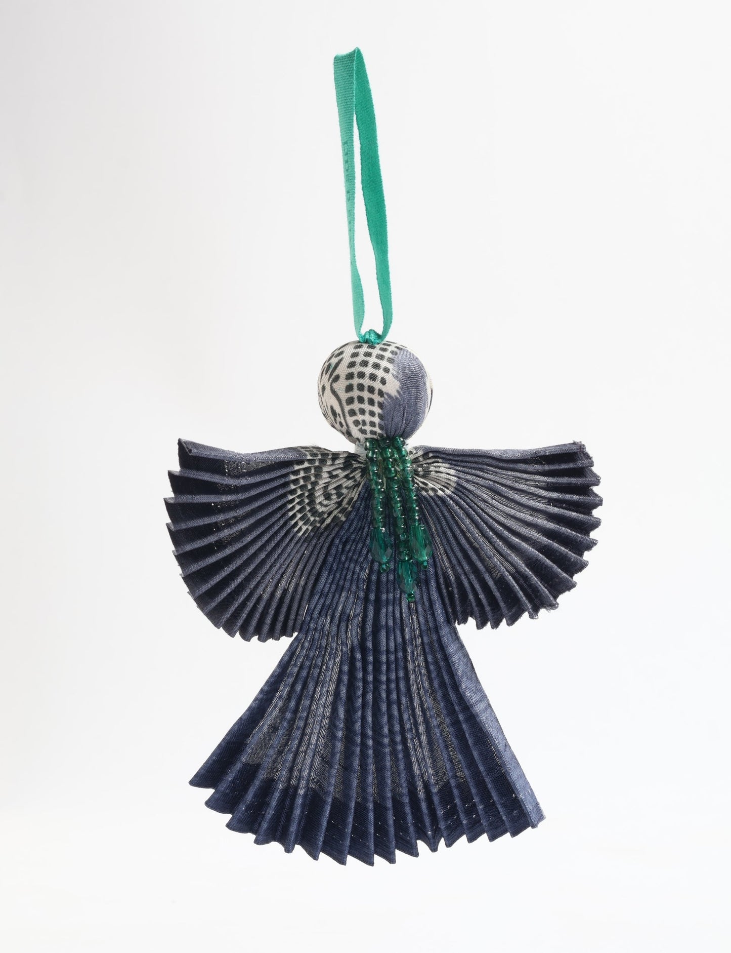 Angel Christmas Ornament made from upcycled saris, featuring pleated arms and body. A sustainable, eco-friendly holiday decoration, embodying recycled fashion and upcycling in festive style.





