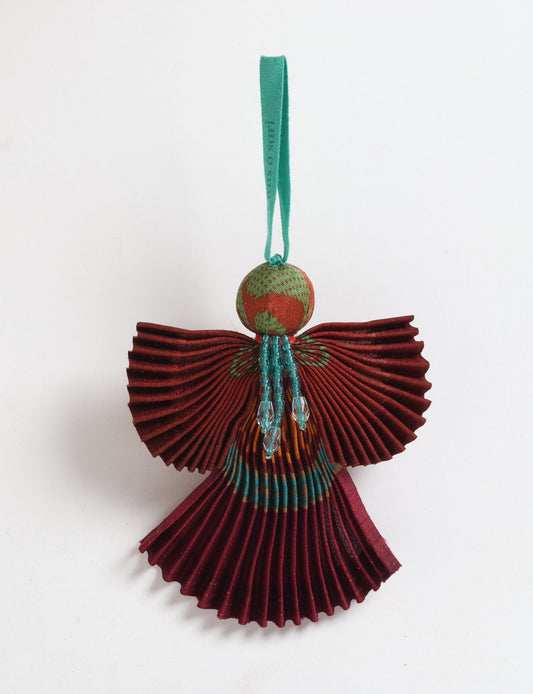 Angel Christmas Ornament made from upcycled saris, featuring pleated arms and body. A sustainable, eco-friendly holiday decoration, embodying recycled fashion and upcycling in festive style.





