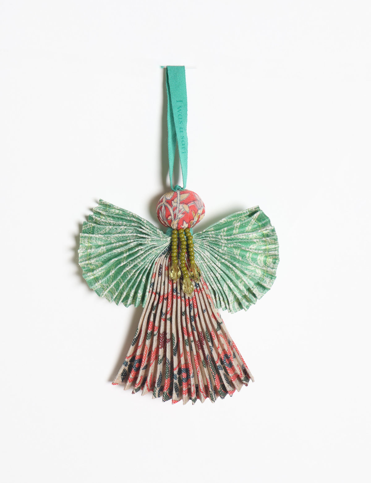 Angel Christmas Ornament made from upcycled saris, featuring pleated arms and body. A sustainable, eco-friendly holiday decoration, embodying recycled fashion and upcycling in festive style.





