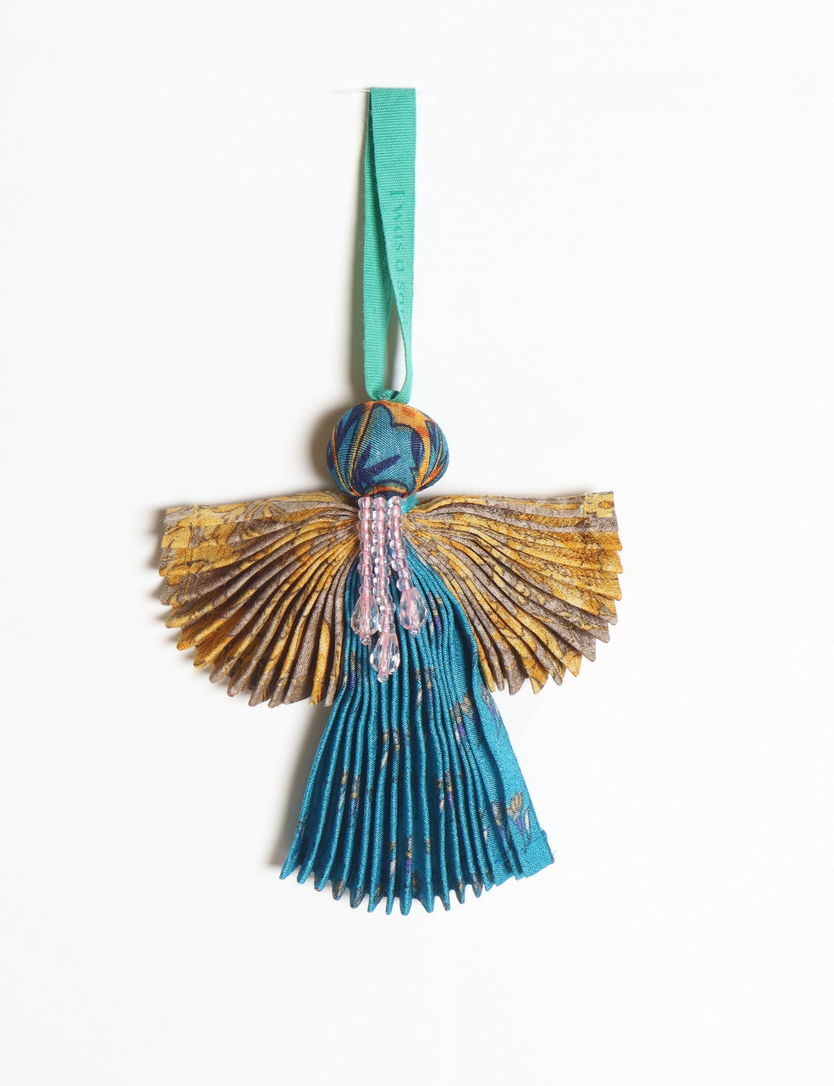 Angel Christmas Ornament made from upcycled saris, featuring pleated arms and body. A sustainable, eco-friendly holiday decoration, embodying recycled fashion and upcycling in festive style.





