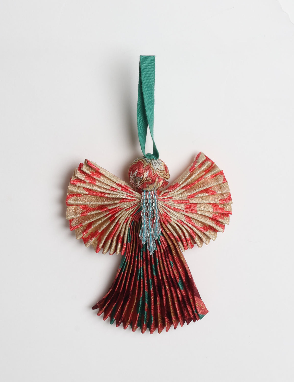 Angel Christmas Ornament made from upcycled saris, featuring pleated arms and body. A sustainable, eco-friendly holiday decoration, embodying recycled fashion and upcycling in festive style.





