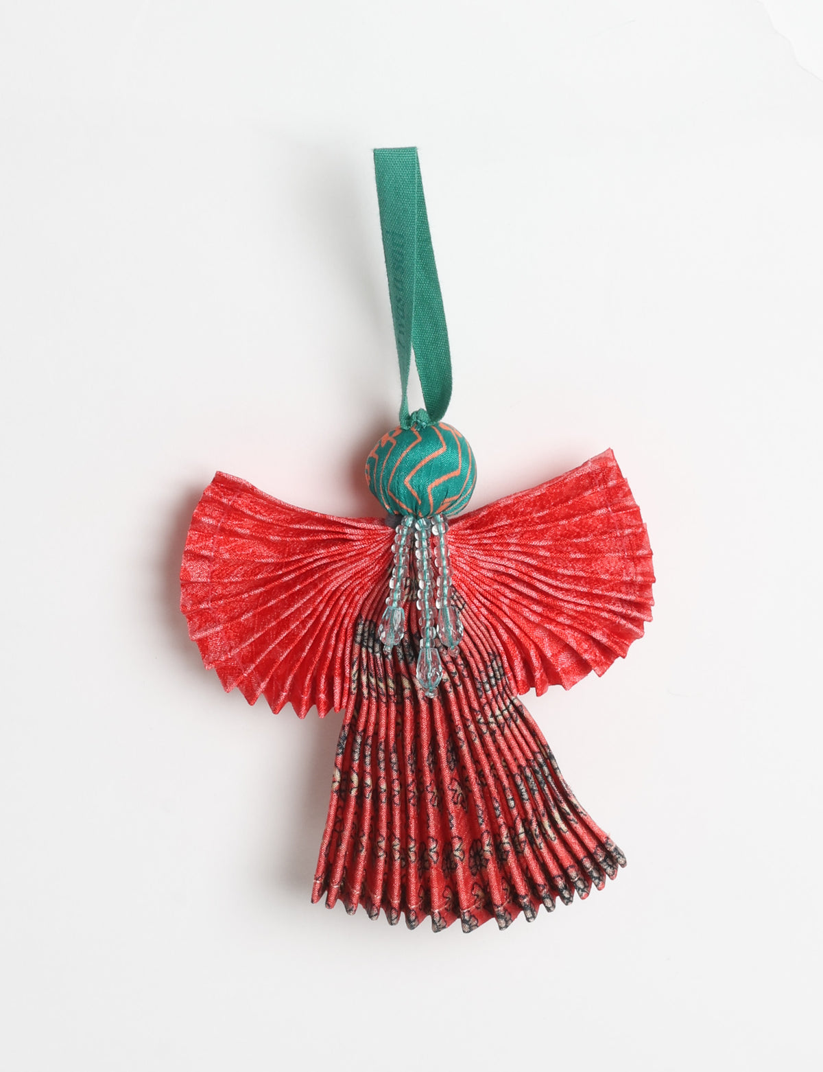 Angel Christmas Ornament made from upcycled saris, featuring pleated arms and body. A sustainable, eco-friendly holiday decoration, embodying recycled fashion and upcycling in festive style.





