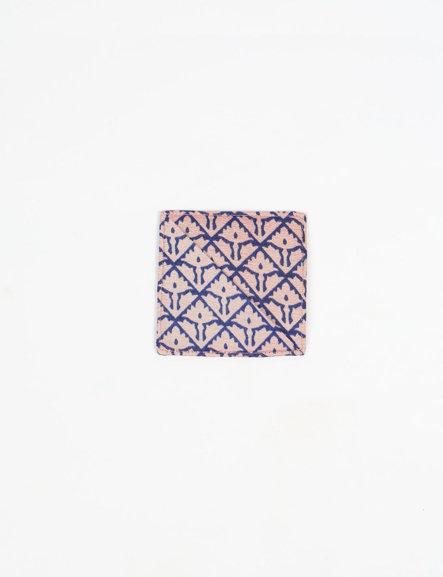 Colorful square-shaped corner bookmark made from recycled sari textiles, representing repurposed clothing, fair trade fashion, and ethical fashion. An earth-friendly product made from textile waste, aligning with carbon neutral clothing values.