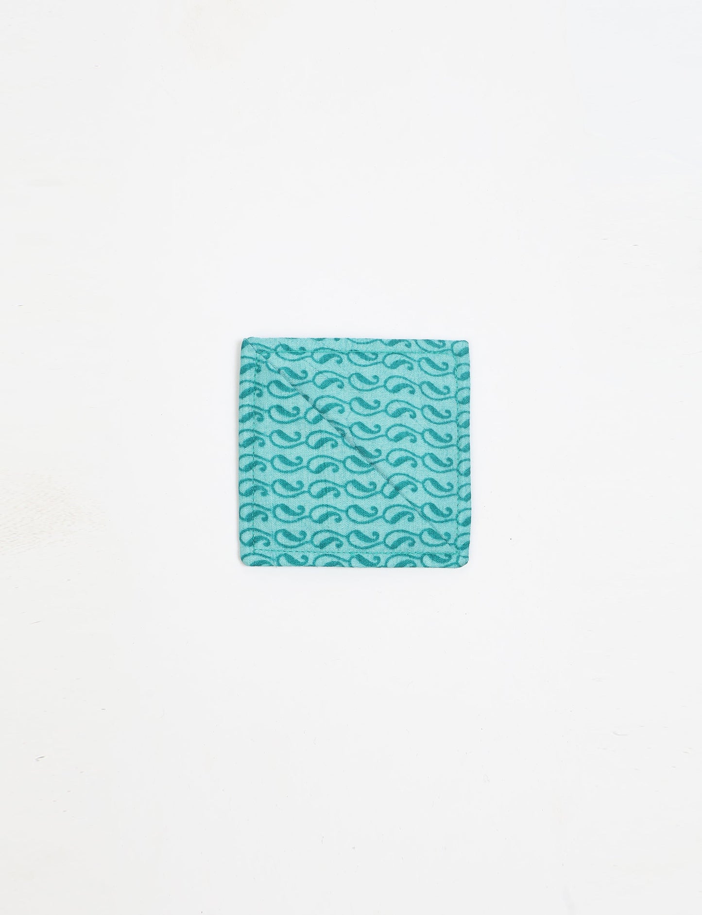 Colorful square-shaped corner bookmark made from recycled sari textiles, representing repurposed clothing, fair trade fashion, and ethical fashion. An earth-friendly product made from textile waste, aligning with carbon neutral clothing values.