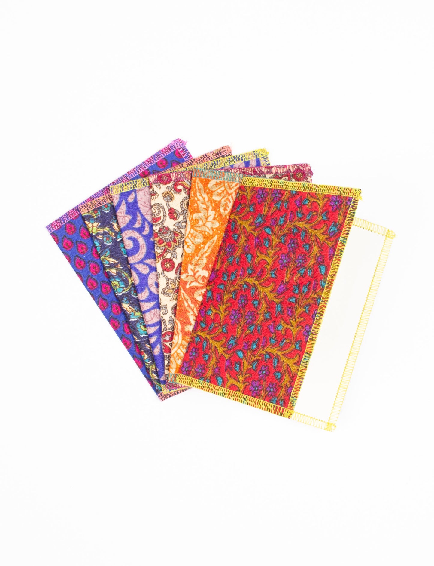 Folded Celebration Card Set, 6 pieces made from recycled sari fabric, showcasing sustainable, eco-friendly, and upcycled fashion principles. Ideal for sending wishes while supporting circular fashion, sustainable apparel, and environmentally friendly practices.