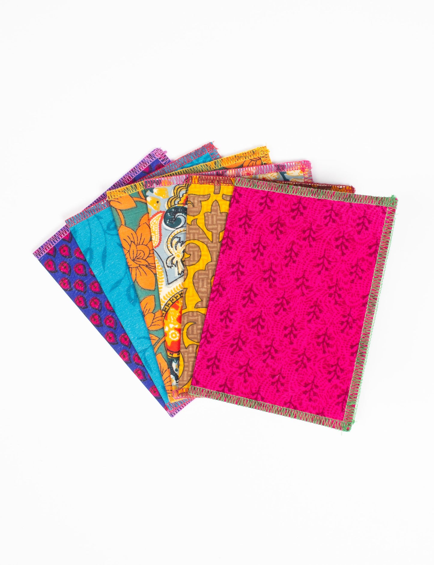 Folded Celebration Card Set, 6 pieces made from recycled sari fabric, showcasing sustainable, eco-friendly, and upcycled fashion principles. Ideal for sending wishes while supporting circular fashion, sustainable apparel, and environmentally friendly practices.