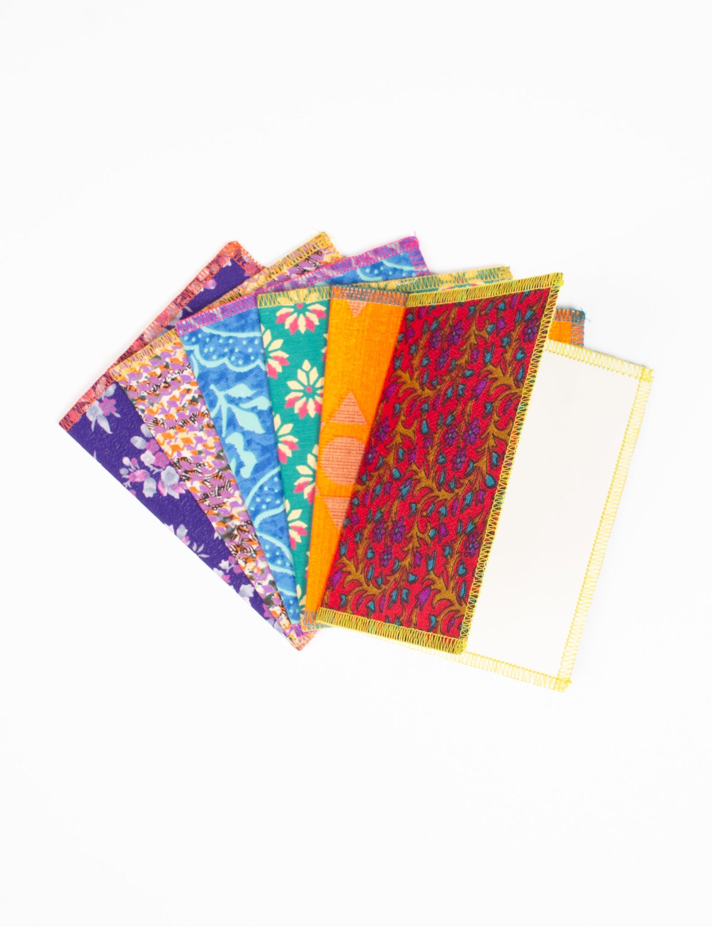 Folded Celebration Card Set, 6 pieces made from recycled sari fabric, showcasing sustainable, eco-friendly, and upcycled fashion principles. Ideal for sending wishes while supporting circular fashion, sustainable apparel, and environmentally friendly practices.