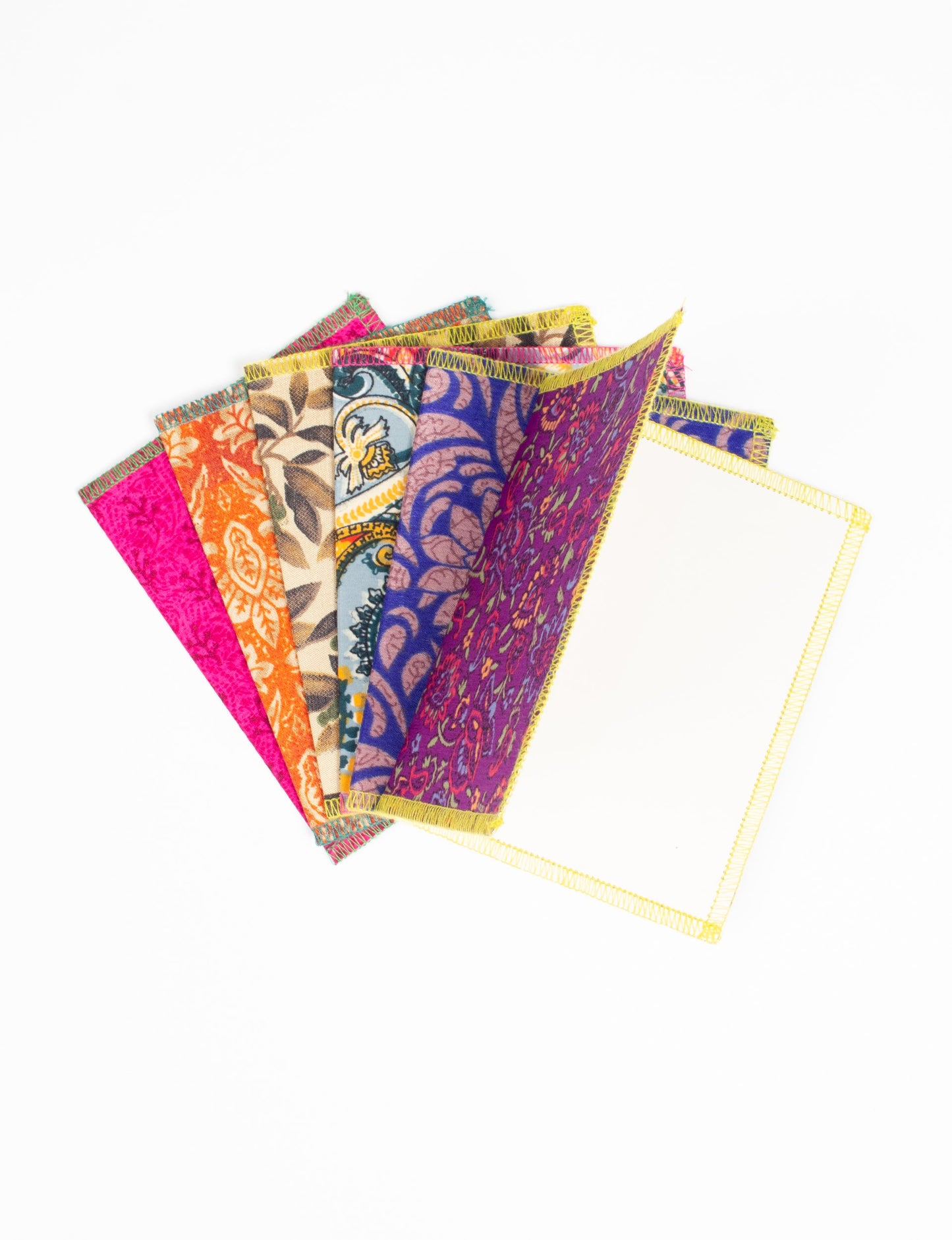 Folded Celebration Card Set, 6 pieces made from recycled sari fabric, showcasing sustainable, eco-friendly, and upcycled fashion principles. Ideal for sending wishes while supporting circular fashion, sustainable apparel, and environmentally friendly practices.